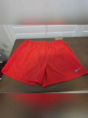 Nike Men's Coral Red Swim Trunks with Silver Swoosh